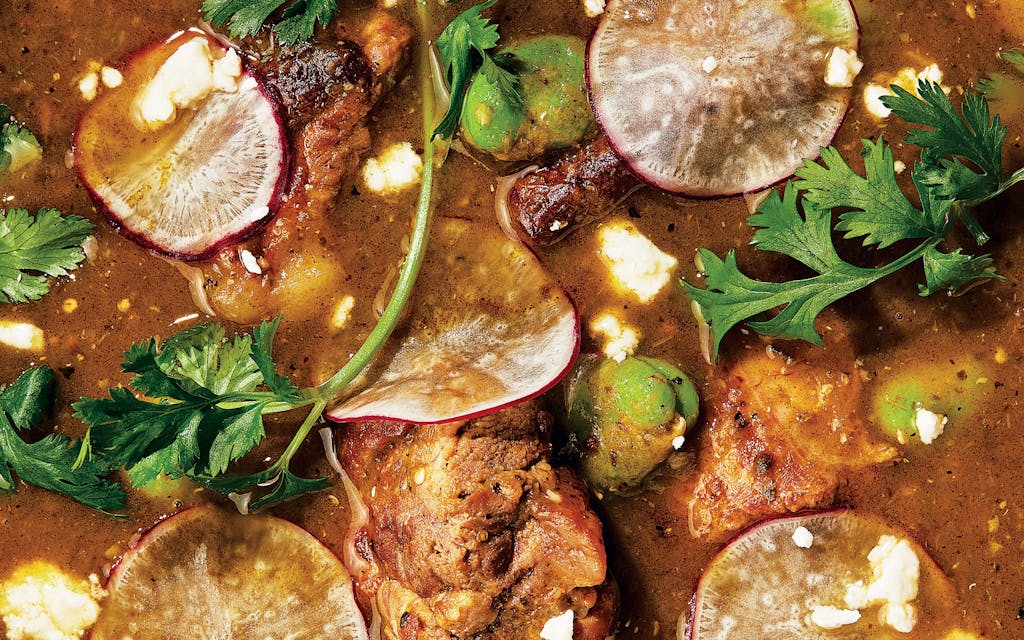 A closeup of the chile verde–braised pork riblets and fava beans.