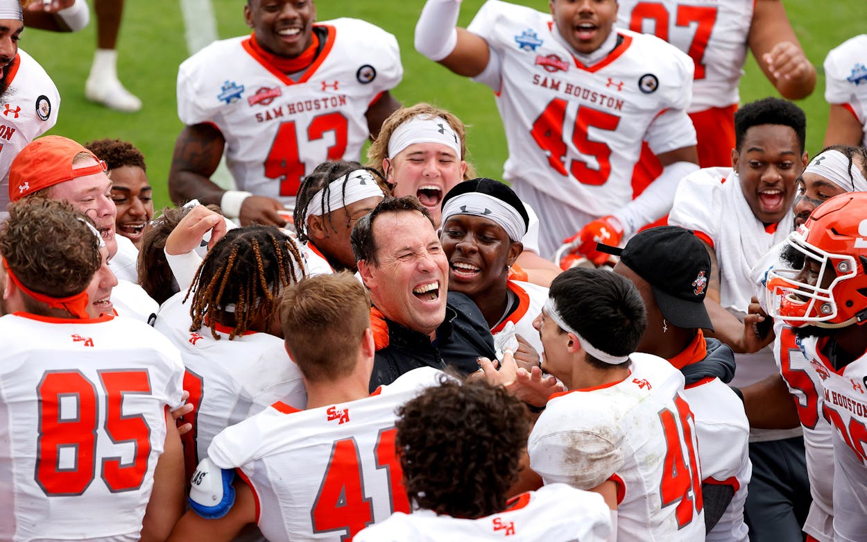 Sam Houston State Bearkats and head coach K.C. Keeler celebrate after defeating South Dakota State in the NCAA college FCS Football Championship in Frisco on May 16, 2021.