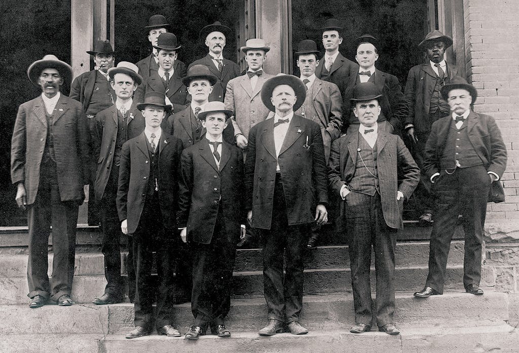 Reeves (far left), at age 69, posing with fellow members of the U.S. Marshals Service on the first day of Oklahoma statehood, November 16, 1907.