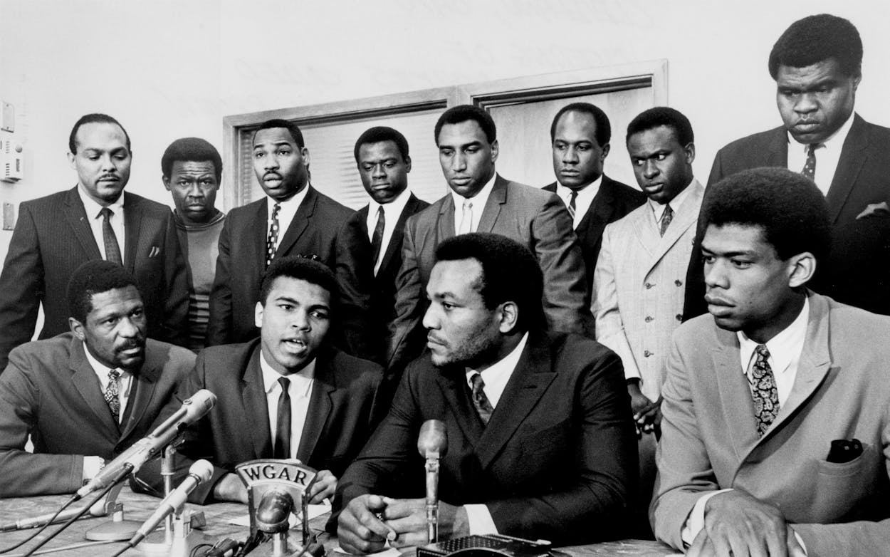 Former Cleveland Browns Hall of Fame running back Jim Brown presides over a meeting of top African-American athletes who supported boxer Muhammad Ali's refusal to fight in Vietnam on June 4, 1967. Pictured: (front row) Bill Russell, Muhammad Ali, Jim Brown, Lew Alcindor; (back row) Carl Stokes, Walter Beach, Bobby Mitchell, Sid Williams, Curtis McClinton, Willie Davis, Jim Shorter, and John Wooten.