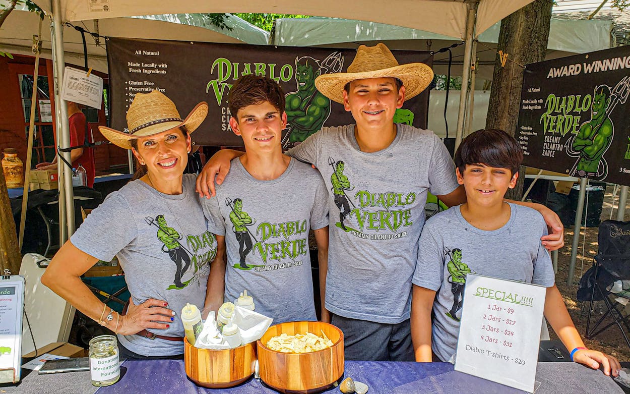 Traci Bourque-Johnson and her sons Ayden, Luke and George sell their Diablo Verde sauce at Fulshear’s Farmer’s Market.