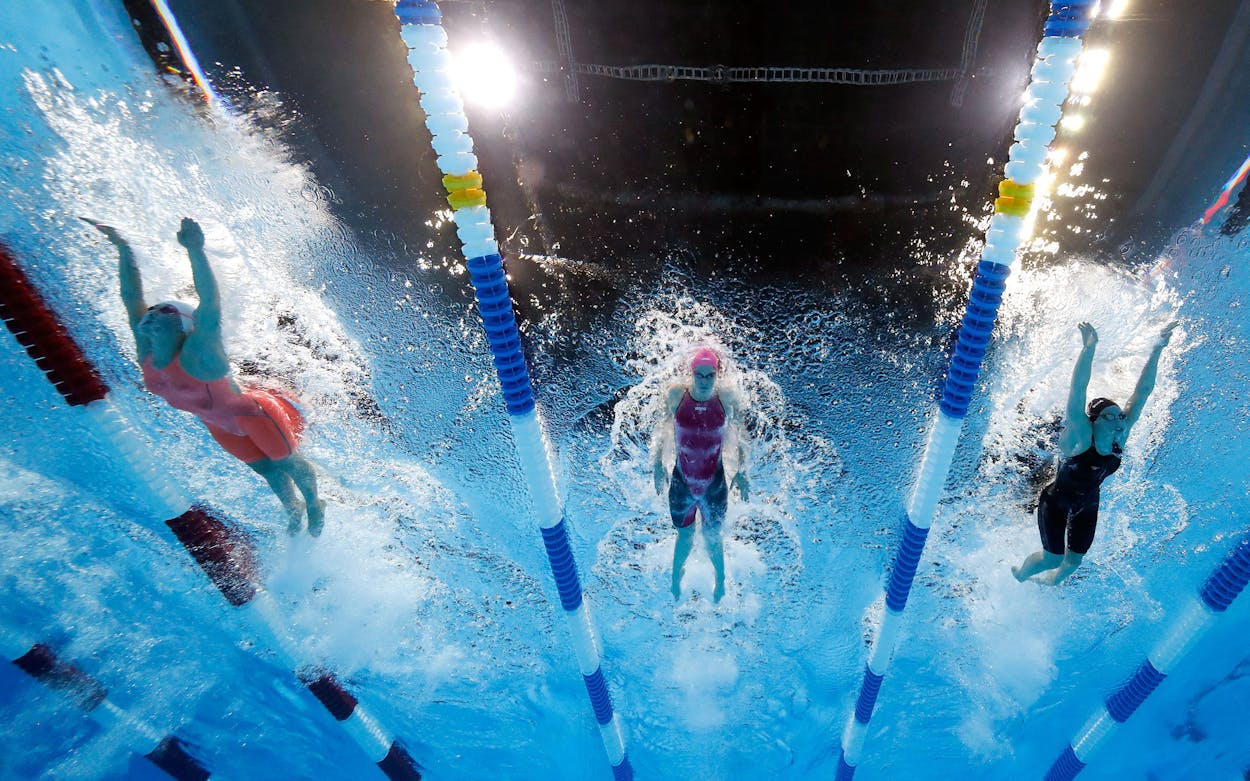 Camille Adams (center) competes in a final heat for the Women's 200 Meter Butterfly during the 2016 U.S. Olympic Team Swimming Trials on June 30, 2016 in Omaha, Nebraska.