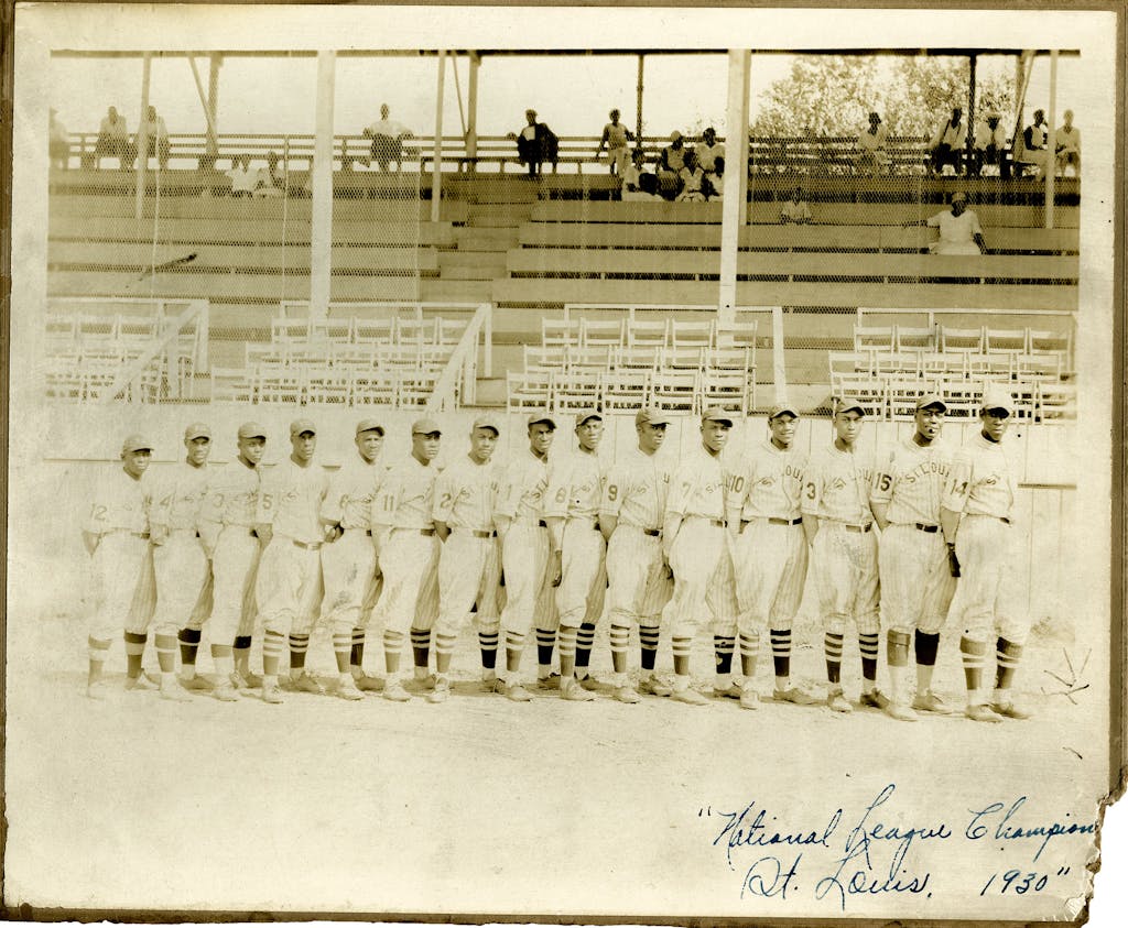 Wells played for the St. Louis Stars 1924-1931. He's pictured here in 1930, second from left, wearing the #4 uniform.