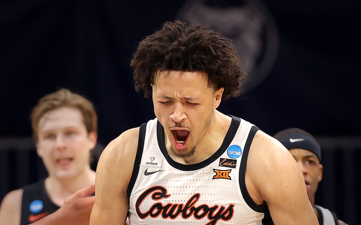 Cade Cunningham of the Oklahoma State Cowboys reacts against the Oregon State Beavers during the second half in the second round game of the 2021 NCAA Men's Basketball Tournament at Hinkle Fieldhouse on March 21, 2021 in Indianapolis, Indiana.