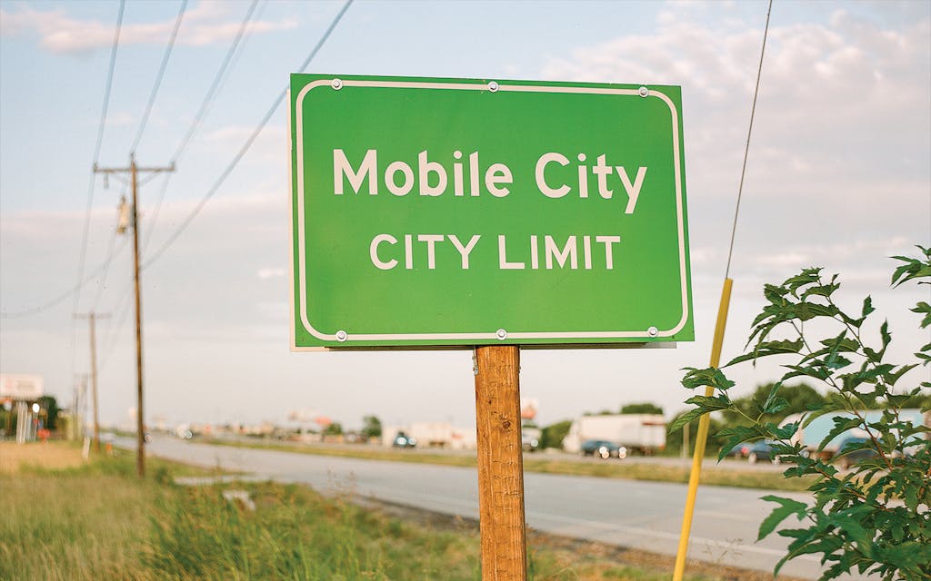 The city limit sign at the intersection of I-30 and Ivey Lane.