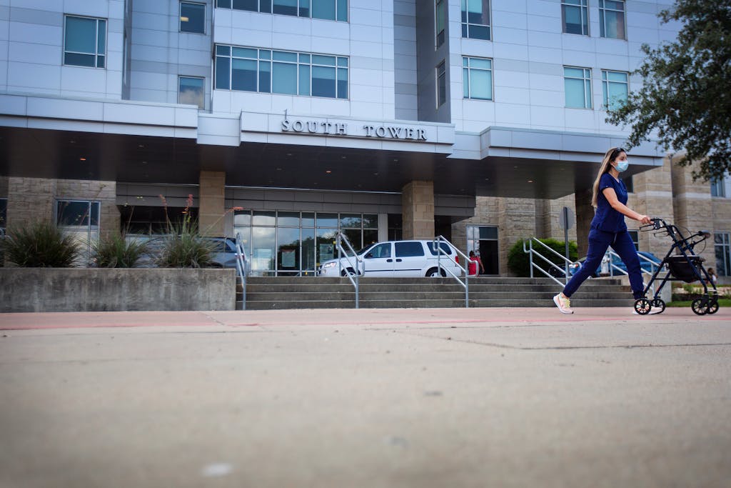 A nurse pushes a walker down a ramp at Baylor Scott & White Medical Center in Temple.