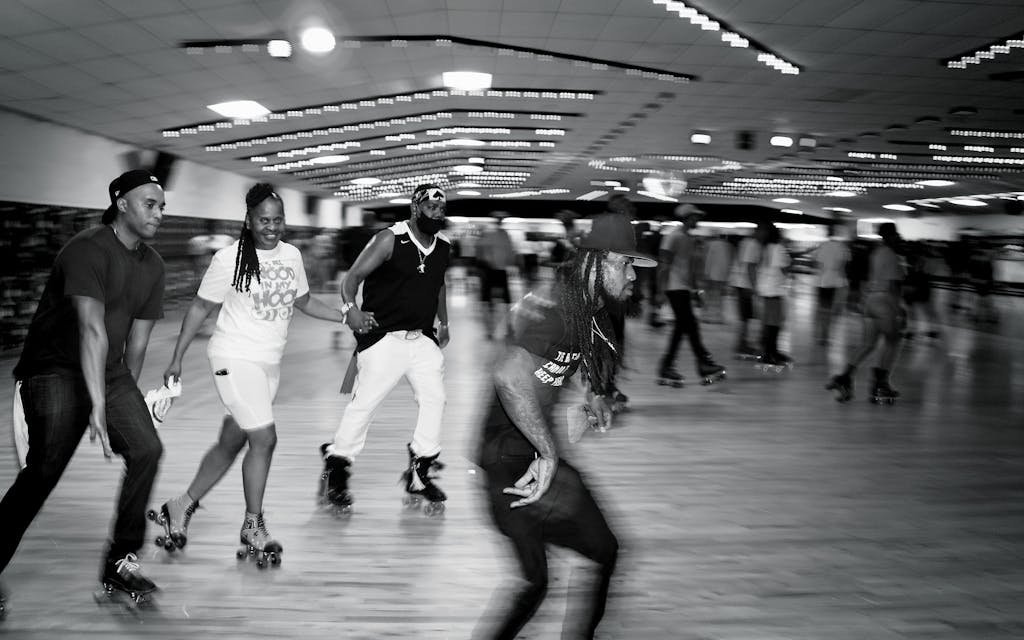 Wanda "Gigi" Brown (second from left) skates at the “It’s All Wood in My Hood” Wood Rydrz Skate Jam at Arlington Skatium on August 14, 2021.