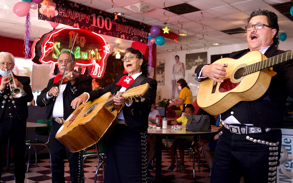 The group Mariachi Aguila Castila performs at the Pig Stand.