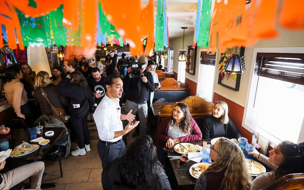 Former Housing and Urban Development Secretary Julian Castro talks with diners during a campaign event while stumping on behalf of Democratic presidential candidate Sen. Elizabeth Warren (D-MA) January 30, 2020 in Marshalltown, Iowa.