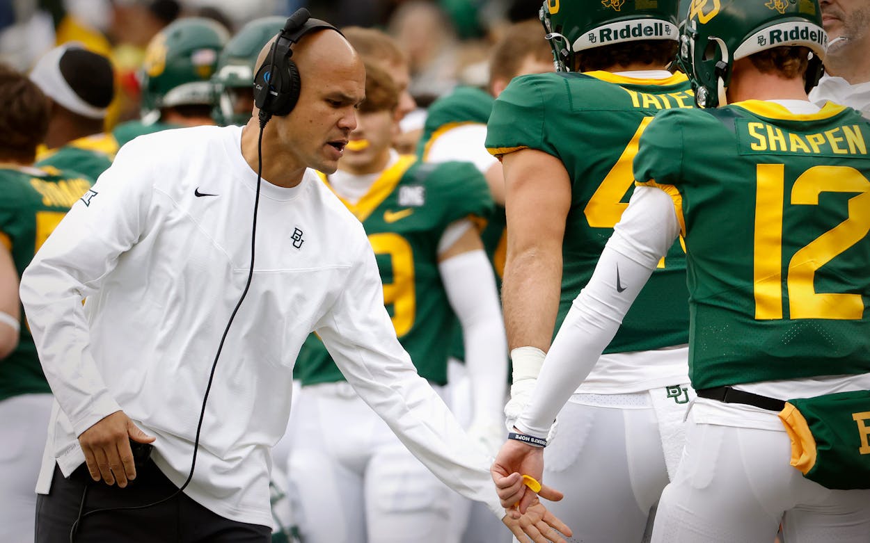 Head coach Dave Aranda celebrates with Blake Shapen #12 of the Baylor Bears during a game against the Texas Tech Red Raiders in the first half at McLane Stadium on November 27, 2021 in Waco, Texas.