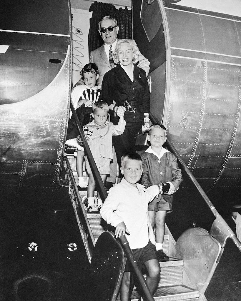 Candace and Jacques Mossler arriving with their four adopted children at Houston International Airport in 1957.