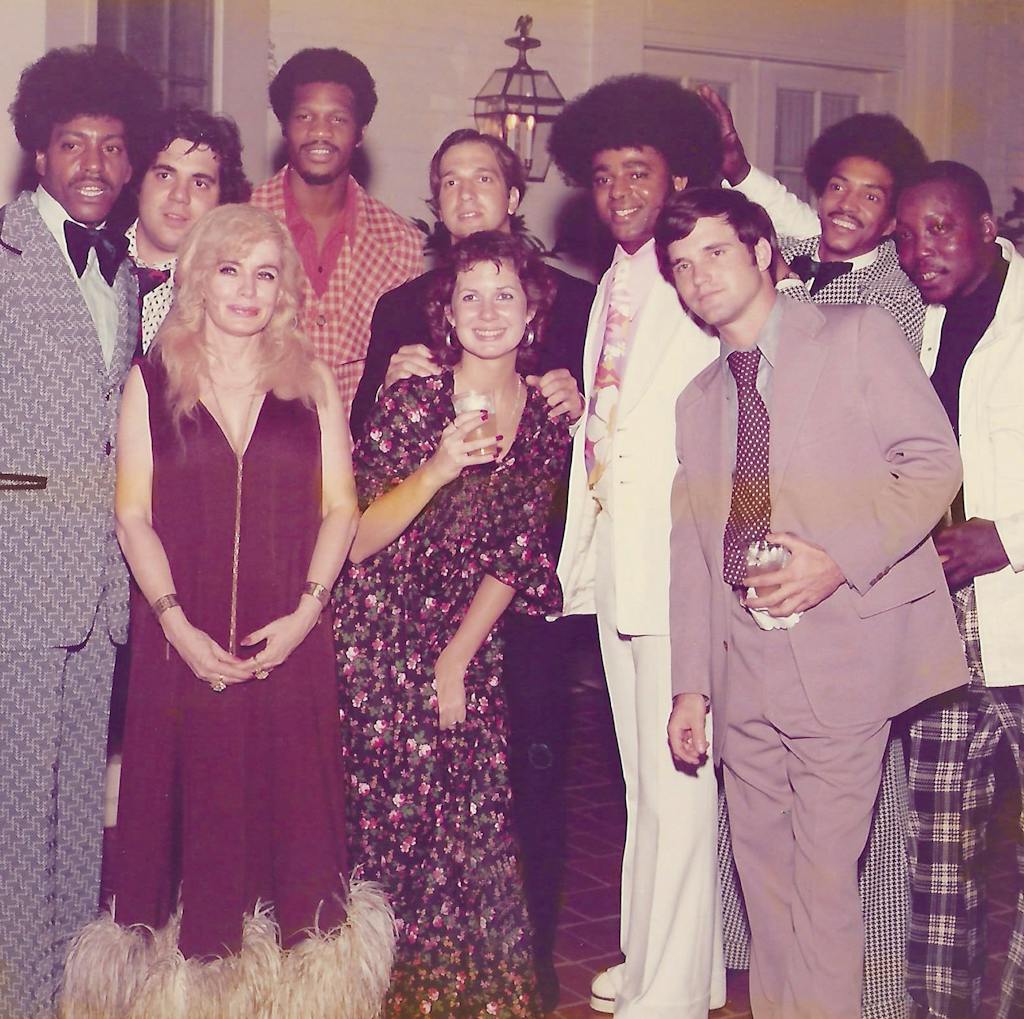 Candace (front left) and guests with the Drifters at a party she hosted in 1973.