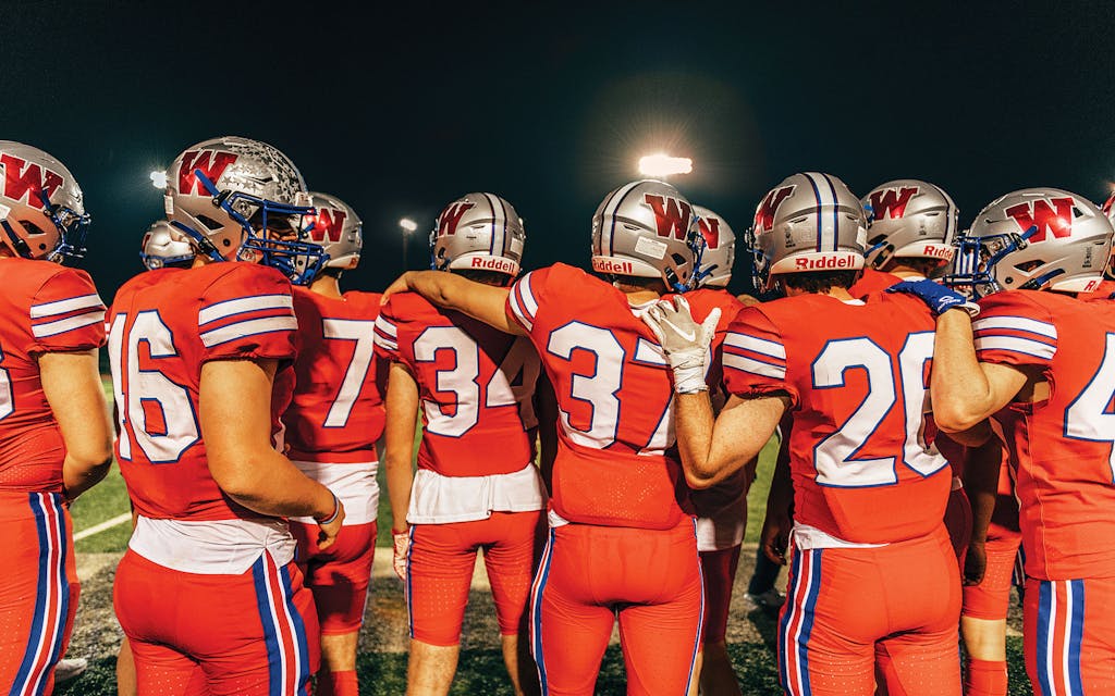 Westlake Chaparrals watch from the sidelines as the team wins its homecoming game 55–6 in Austin on October 22, 2021.