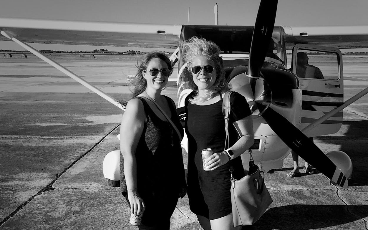 Emily Kimbro (left) and Victoria Millner at an airfield near Austin, scouting for an issue.