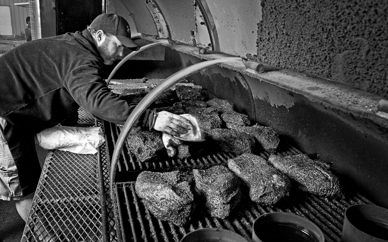 John Mueller, tending his meat on December 10, 2011.