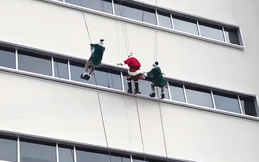 Santa window cleaners at Methodist Children's Hospital in San Antonio