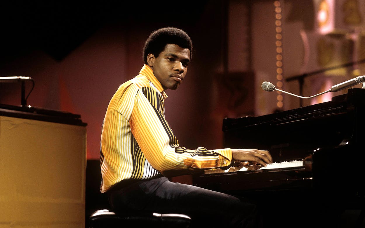Billy Preston playing the piano.