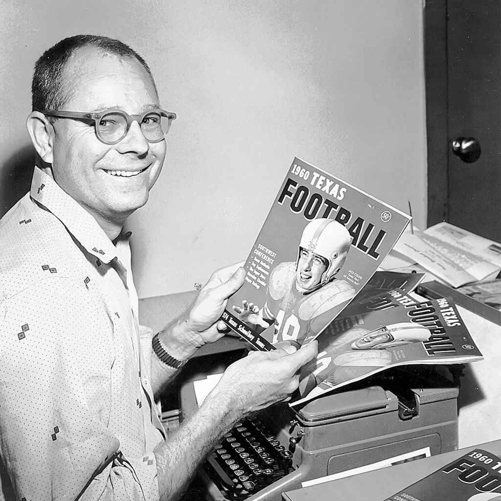 In this updated photo, Dave Campbell holds a copy of his Texas Football Magazine at an office in Waco, Texas. Campbell, founder of the Texas Football preview magazine that became a fixture in this football-crazy state, has died Friday night, Dec. 10, 2021, at his home in Waco, said Greg Tepper, managing editor of Dave Campbell's Texas Football. He was 96.