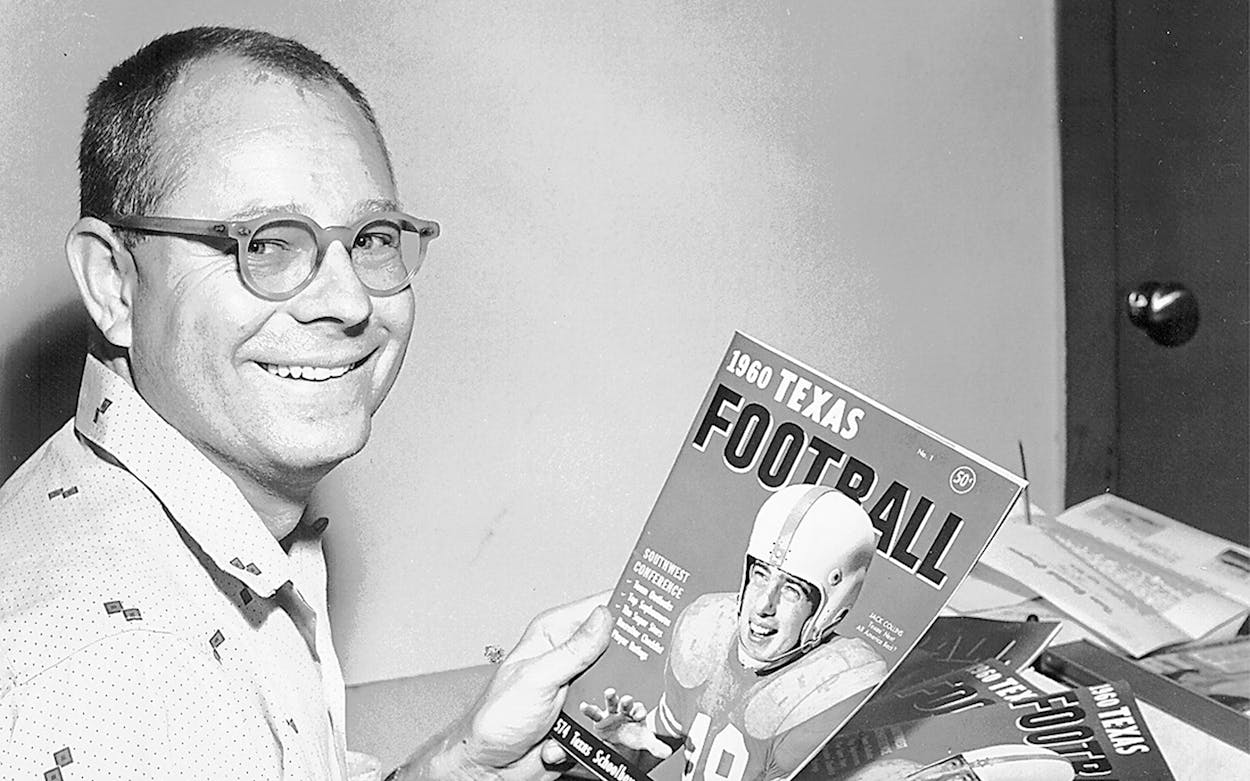 Dave Campbell holds a copy of his Texas Football Magazine at an office in Waco, Texas.