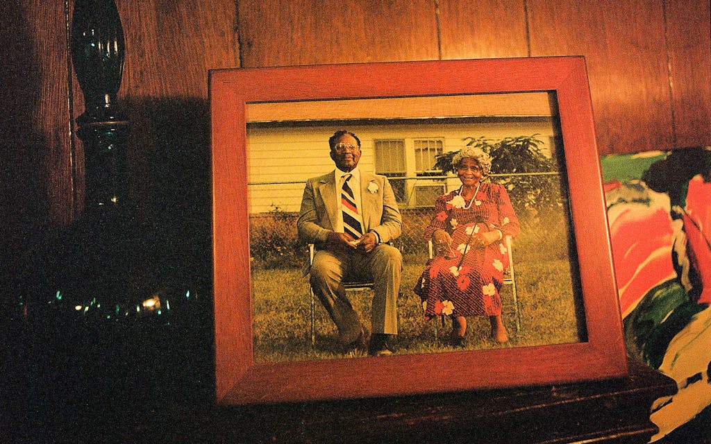 A framed portrait of TK and Leota Upshaw sits on Marilyn's mantle.