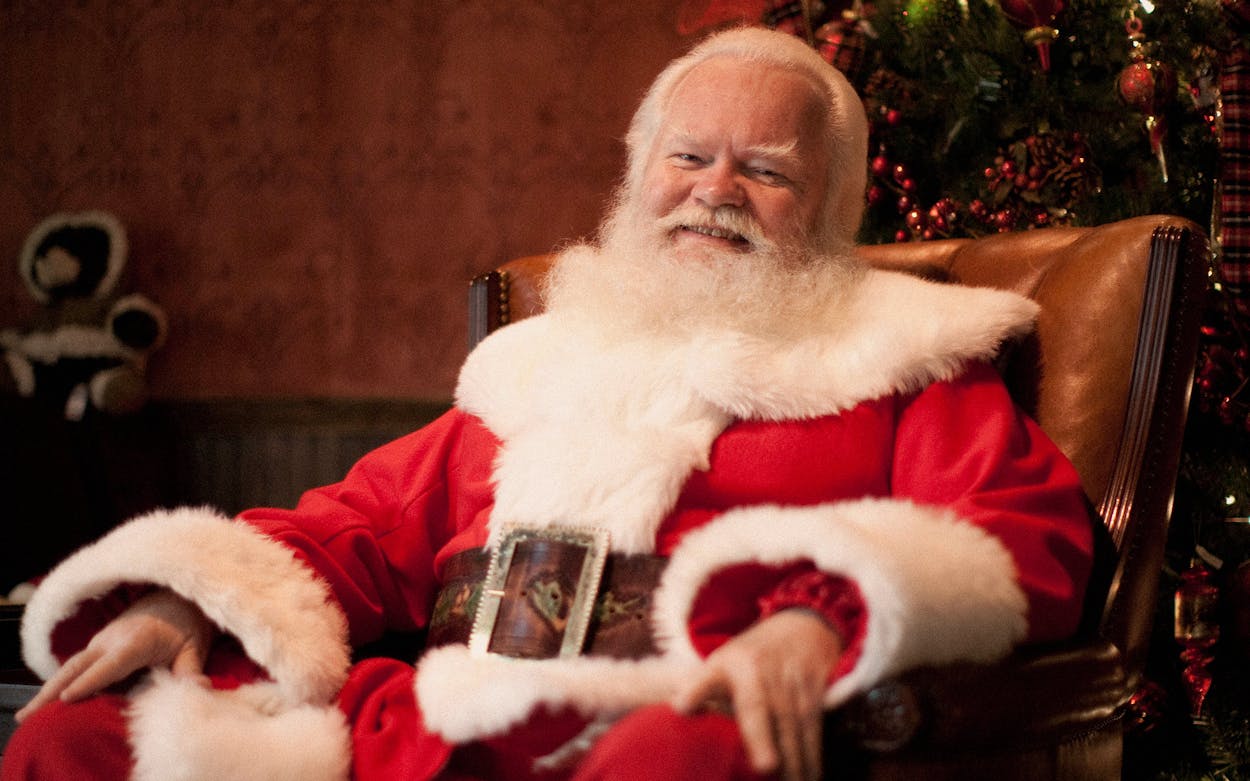 Northpark Center Santa Claus smiling at the camera.