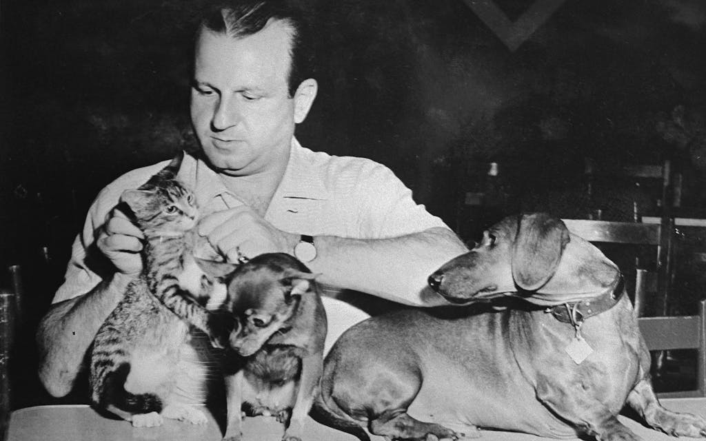 Picture of Jack Ruby with his pets that hung on the wall of his Carousel Club office. 