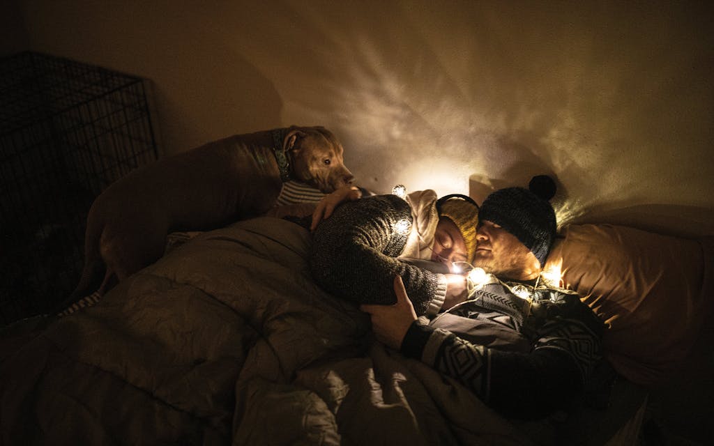 Savannah and Sam Peyton, huddled in their Austin home after more than three days without power, on February 18, 2021.