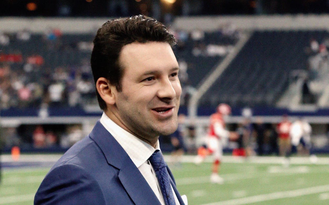 In this Nov. 5, 2017, file photo, CBS football analyst Tony Romo walks across the field during warmups before an NFL football game between the Kansas City Chiefs and the Dallas Cowboys in Arlington, Texas.
