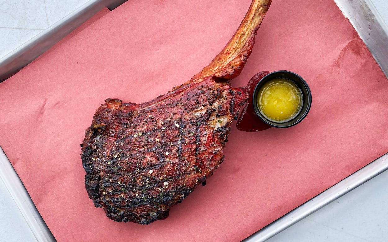 The bone-in tomahawk ribeye steak.