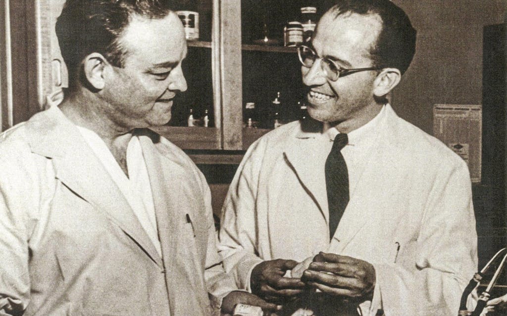 Byron Bennett, left, and Dr. Jonas Salk in the University of Pittsburgh lab in 1954-55.