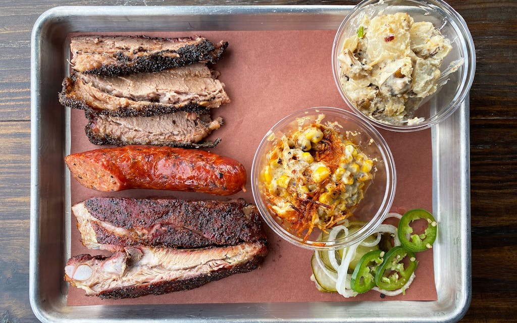 A spread of meats and sides from Bexar Barbecue.