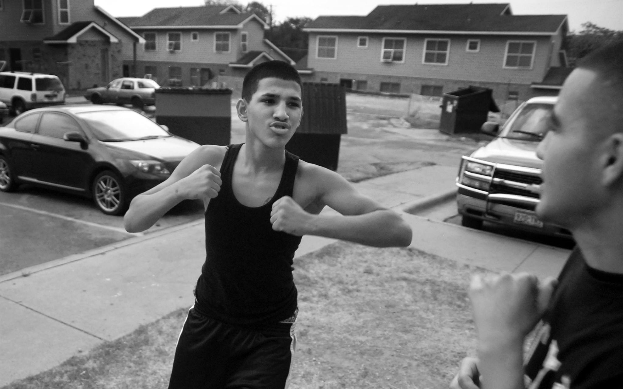 Christian jokingly boxes with his friend Ricardo Lara at Booker T. on July 22, 2009.