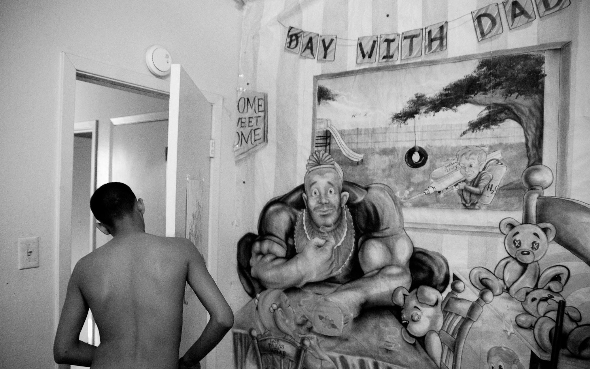 The wall of Christian’s bedroom is covered by a paper mural that his father, Jorge Martinez, painted while he was in prison. Jorge spent more than 8 years of Christian’s childhood incarcerated for aggravated assault. He painted the mural for Christian to commemorate a “Day With Dad,” a special event during which inmates were allowed to play with their children for a day on the prison grounds.