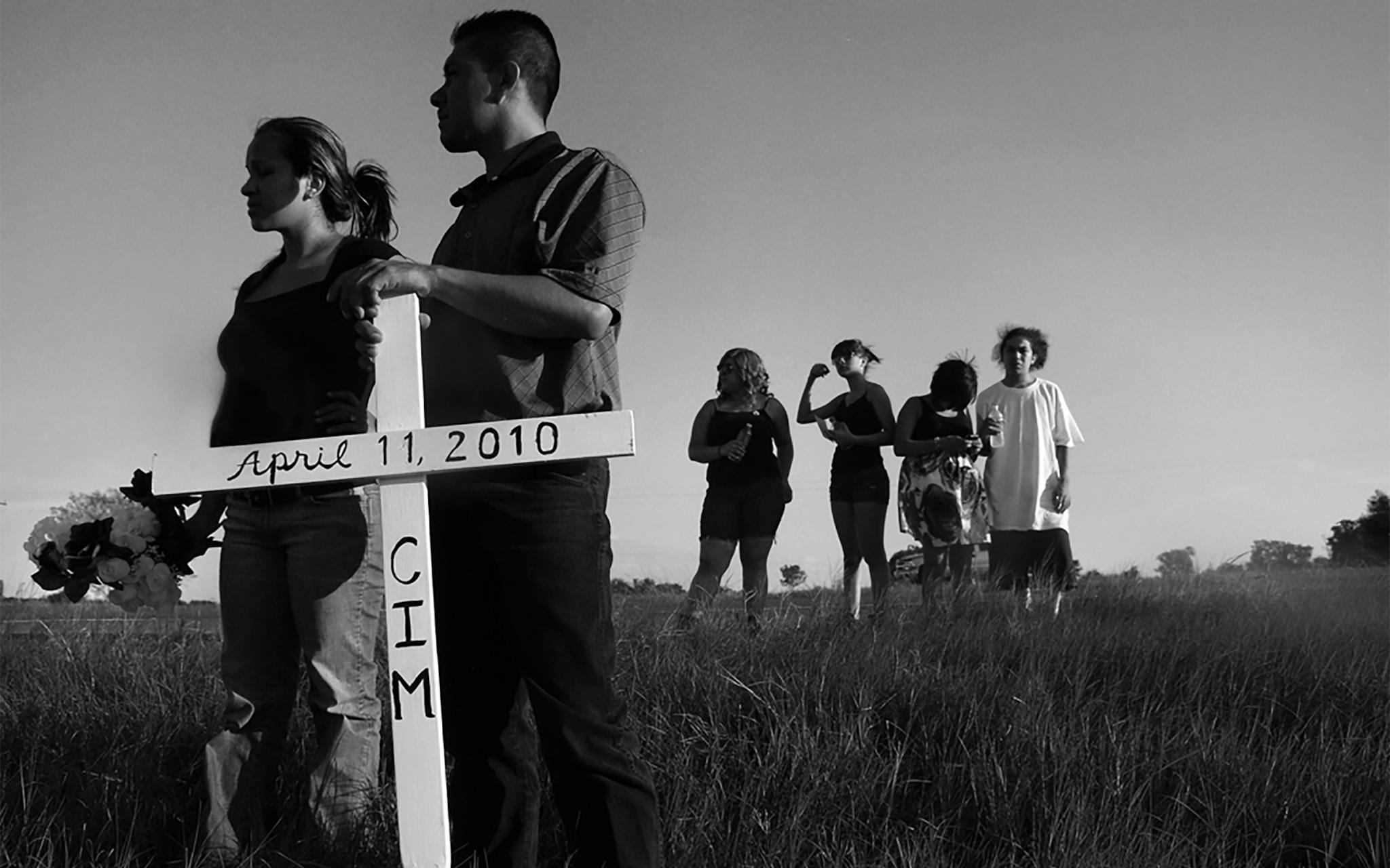 Christian’s family and friends preparing to place a commemorative cross at the site of his fatal accident, along U.S. 290, on August 15, 2010.