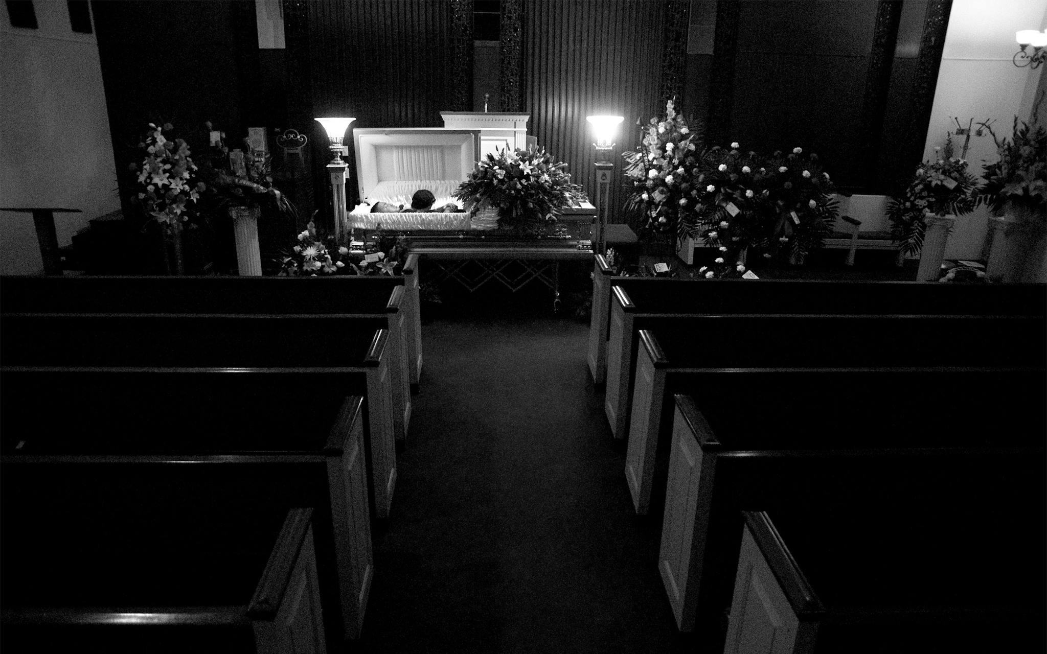 Christian’s body lies in a casket after a private visitation for family and friends at King-Tears Mortuary in East Austin on April 23, 2010.