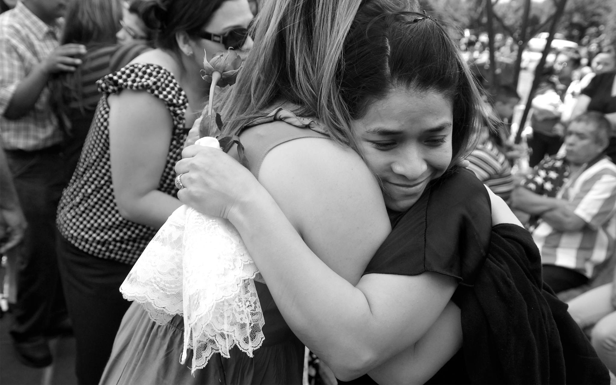 Maricela receiving a hug from Amy McMillan, a counselor at Christian’s middle school and a close friend of the family, at the graveside service on April 24, 2010.