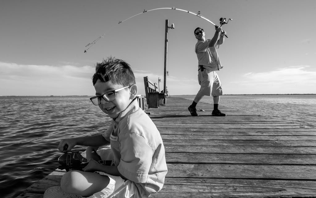 Isidro Cruz fishing with his son, Isidro Jr., on Corpus Christi Bay on June 11, 2020.
