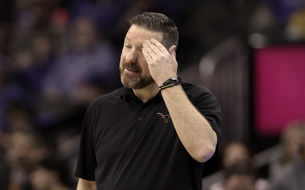Head coach Chris Beard of the Texas Longhorns reacts in the second half against the TCU Horned Frogs during the first round game of the 2022 Phillips 66 Big 12 Men's Basketball Tournament at T-Mobile Center on March 10, 2022 in Kansas City, Missouri.