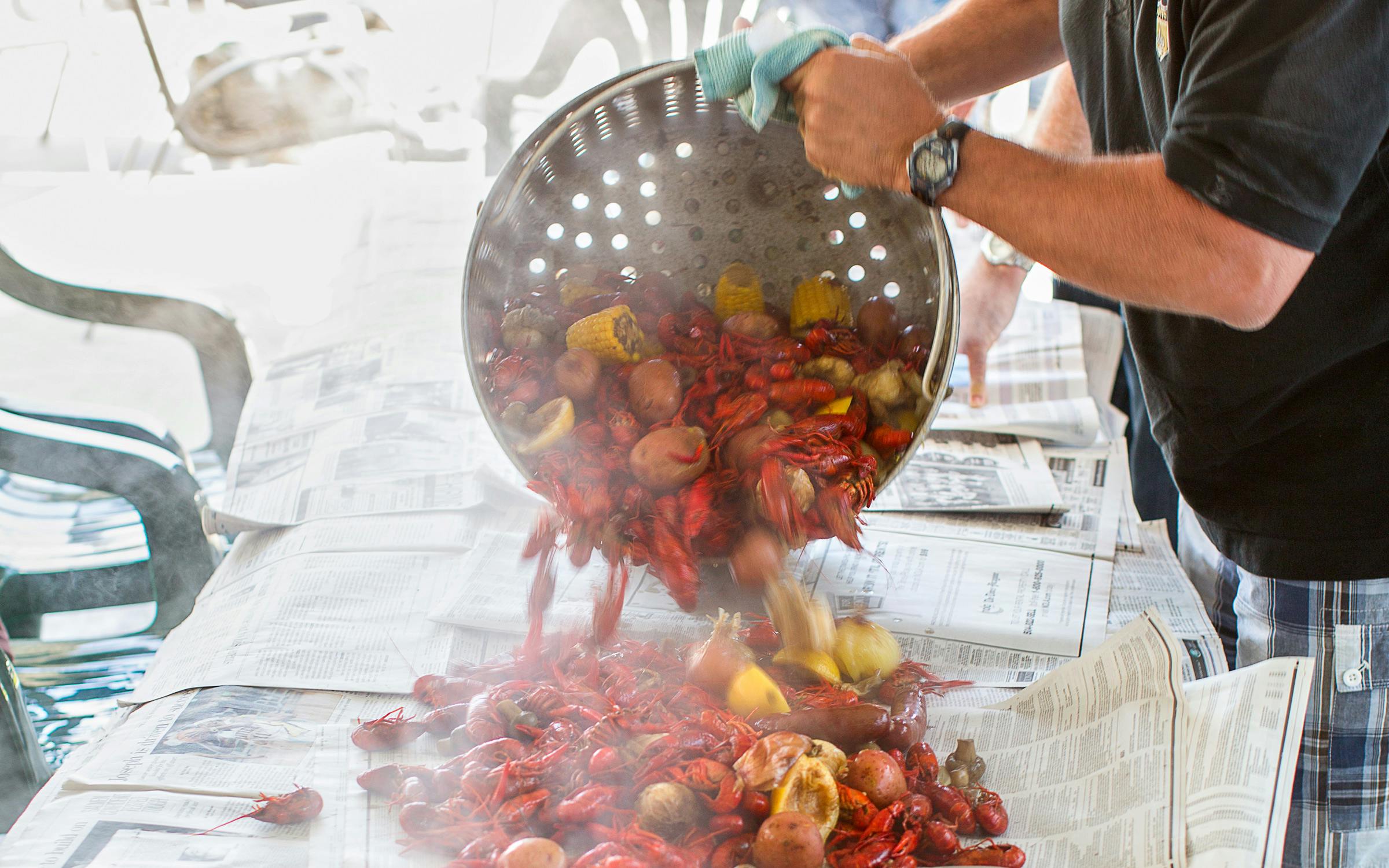https://img.texasmonthly.com/2022/03/texas-crawfish-boil.jpg?auto=compress&crop=faces&fit=fit&fm=pjpg&ixlib=php-3.3.1&q=45