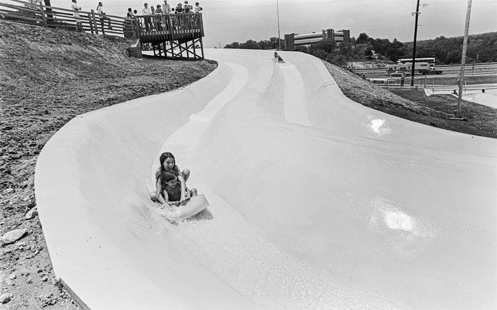 The concrete slide was coated with blue paint, and few riders left the water park without a scrape or bruise.