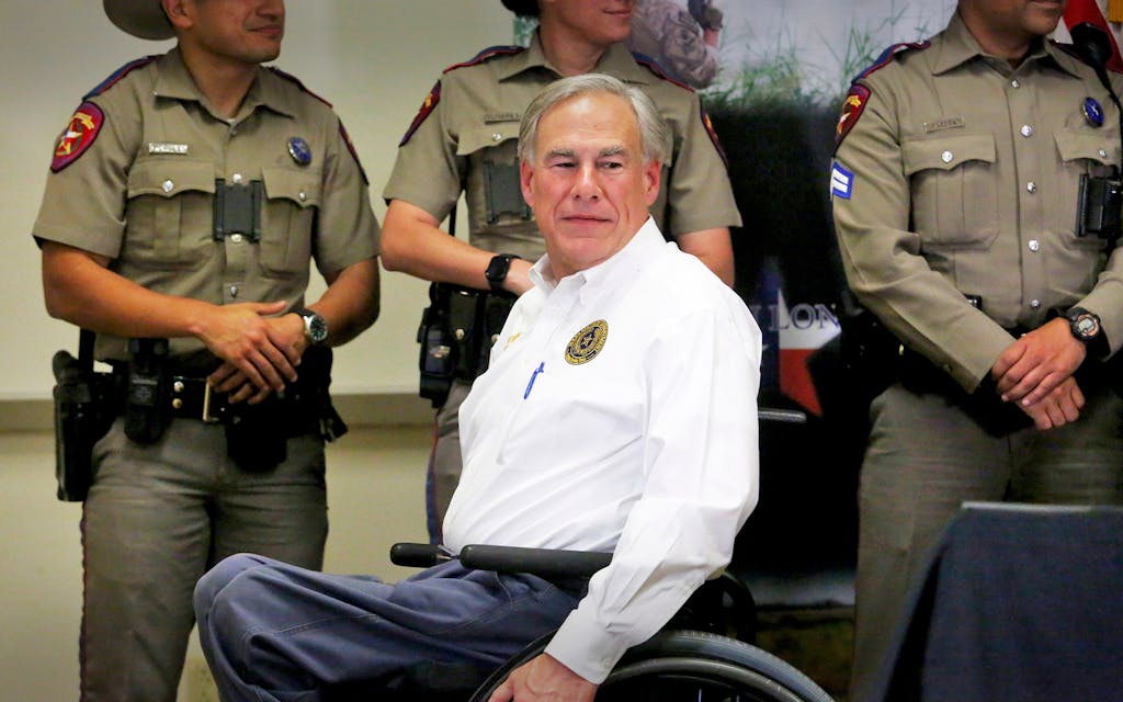 Texas Governor Greg Abbott turns his wheelchair around after greeting Texas DPS officers before the start of a press conference at the Texas Department of Public Safety Weslaco Regional Office on Wednesday, April 6, 2022, in Weslaco, Texas. Abbott says the state will provide migrants arriving at the U.S.-Mexico border bus charters to Washington, D.C. The move announced Wednesday amounts to a taunt at President Joe Biden and Congress over what the Republican governor calls a failure by the federal government to stop the flow of migrants coming to the southern border.