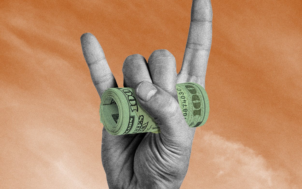 University of Texas hand sign holding rolled up dollar bills