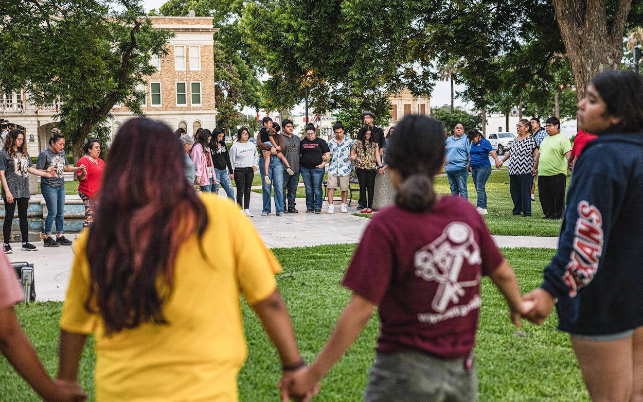Members of the community gather at the City of Uvalde Town Square for a prayer vigil in the wake of a mass shooting at Robb Elementary School on May 24, 2022 in Uvalde.