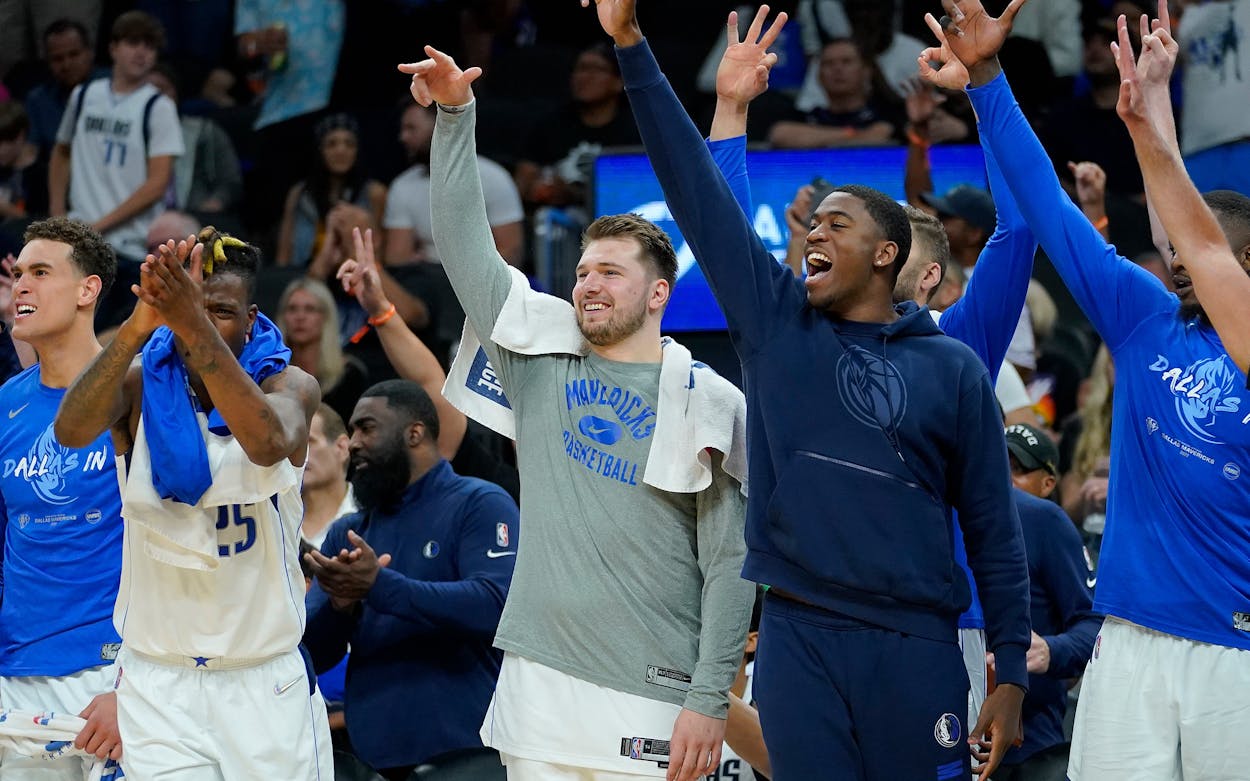 Dallas Mavericks players celebrate during the second half of Game 7 of an NBA basketball Western Conference playoff semifinal against the Phoenix Suns.