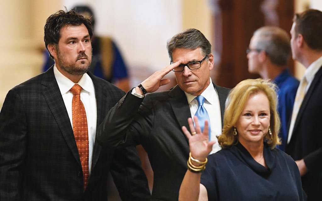 Marcus Luttrell with former governor Rick Perry and former Texas first lady Anita Perry at the Texas capitol on May 5, 2016.