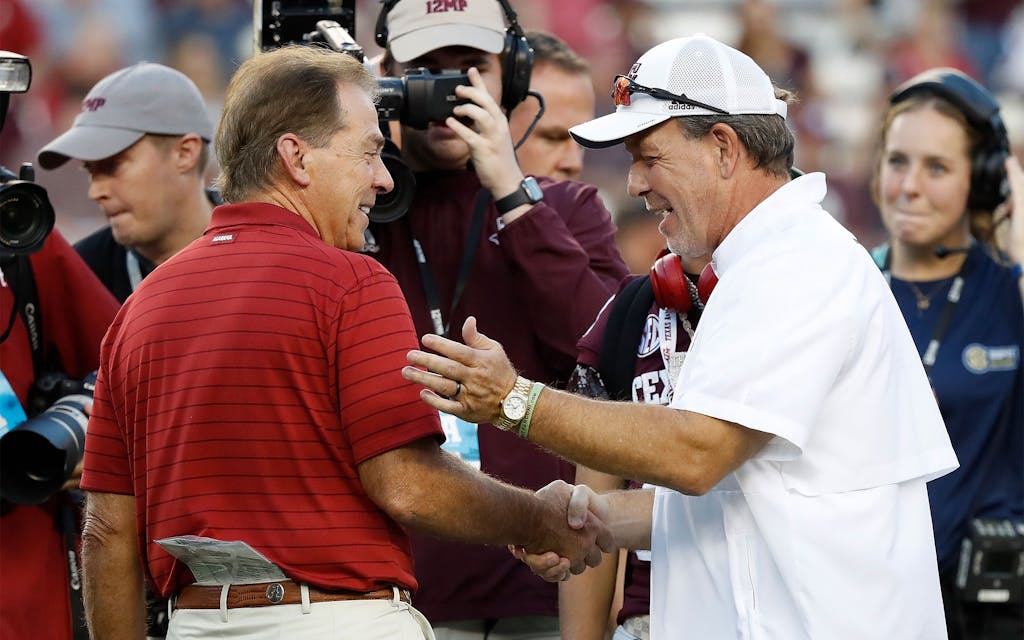 Nick Saban and Jimbo Fisher meet before a game at Kyle Field in 2021.