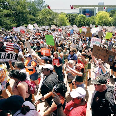 Protesters hold a rally at Discovery Green Park, across the street from the National Rifle Association Annual Meeting held at the George R. Brown Convention Center in Houston on May 27, 2022.