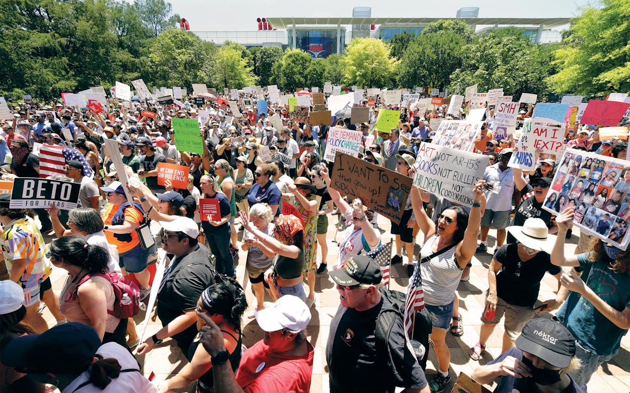 Protesters hold a rally at Discovery Green Park, across the street from the National Rifle Association Annual Meeting held at the George R. Brown Convention Center in Houston on May 27, 2022.