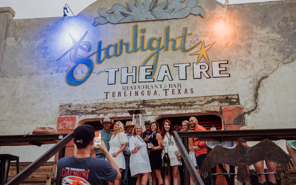 A group of Dallasites celebrate a birthday at Starlight Theatre in Terlingua on June 2, 2022.