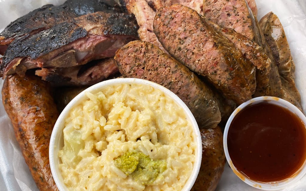 Smoked meats with broccoli rice casserole.